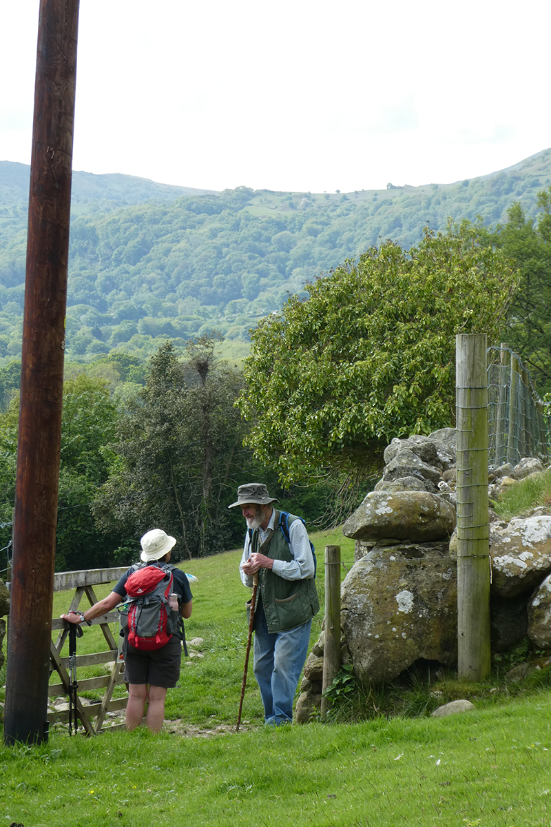 two people talikng on a pathway