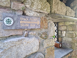 Pilgrims Stamp Sign at Wooden Mill in Penygroes